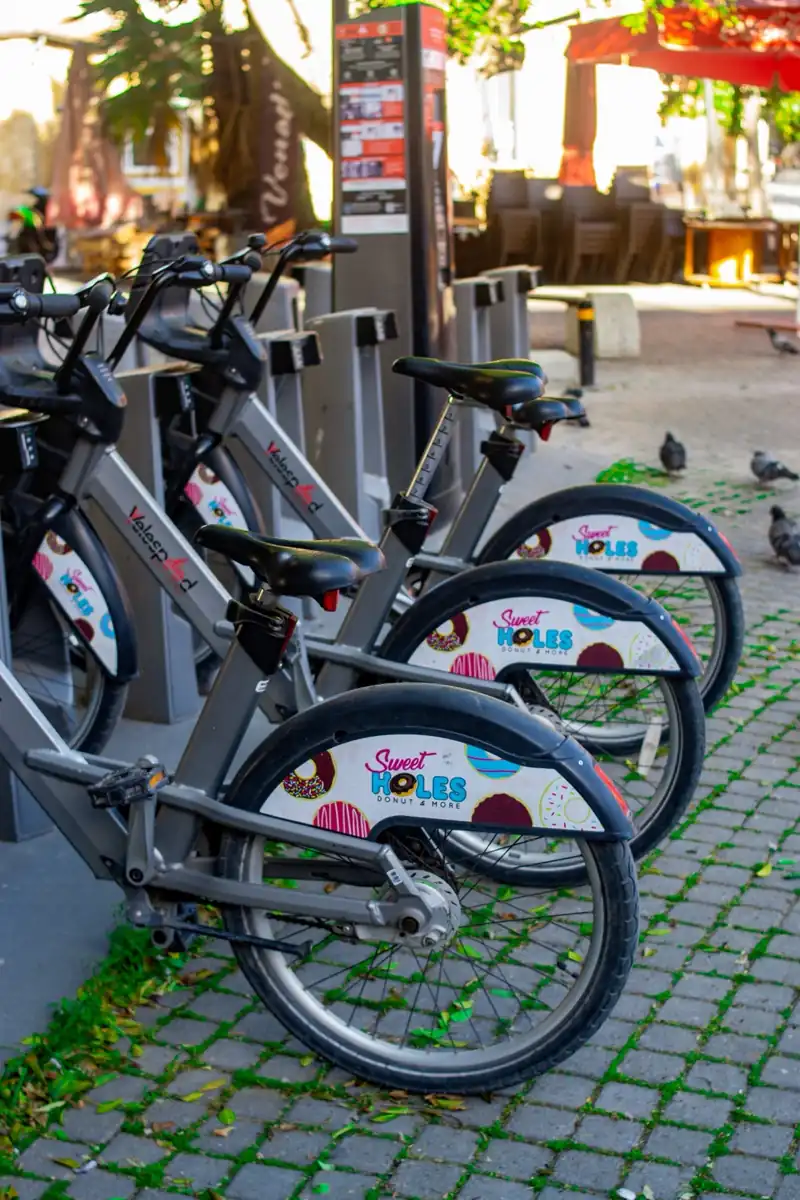 Row of rental bicycles photographed on a city street